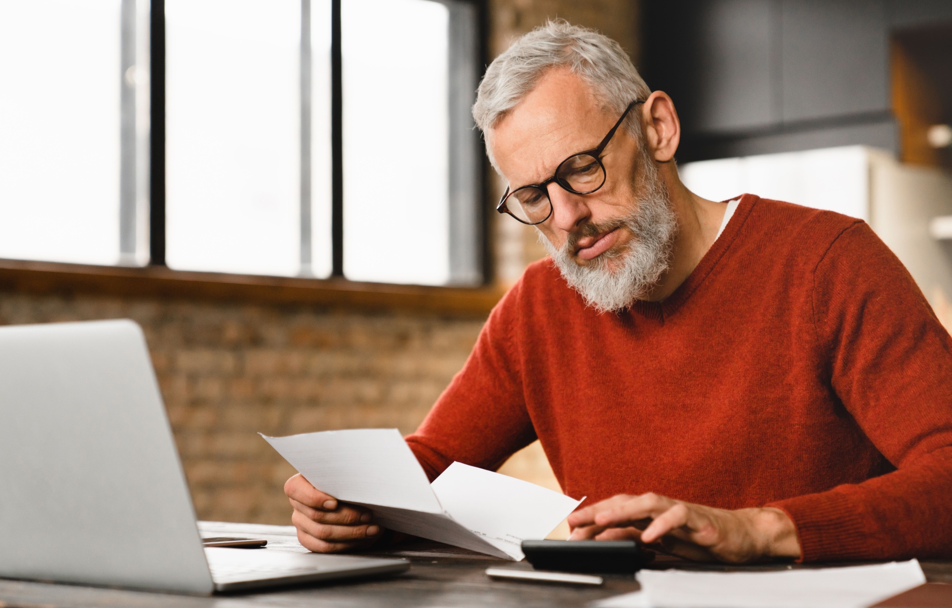 A man reading some paperwork.